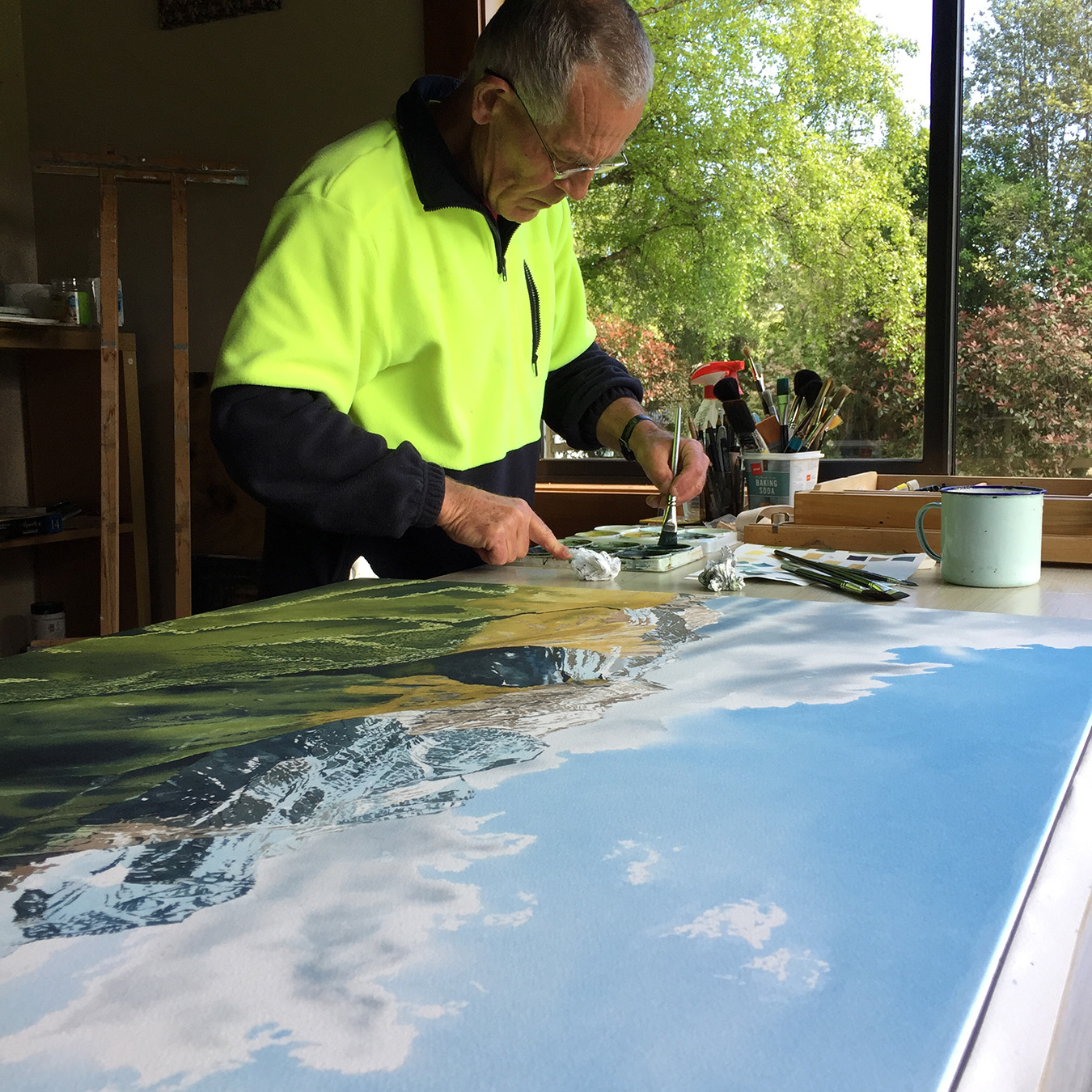 Dennis painting in studio